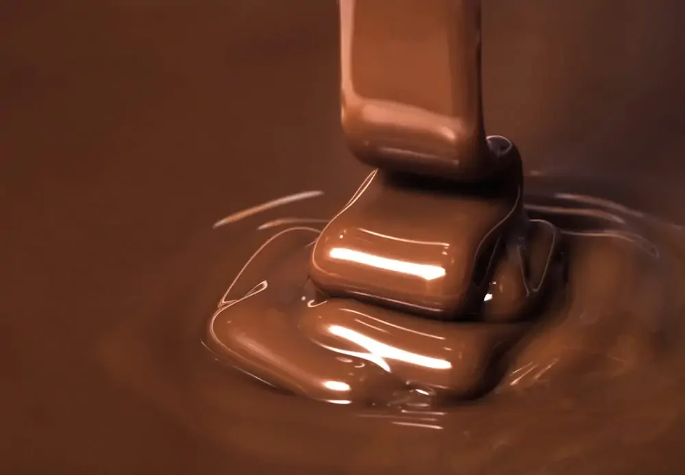 melted milk chocolate being poured in a thick stream