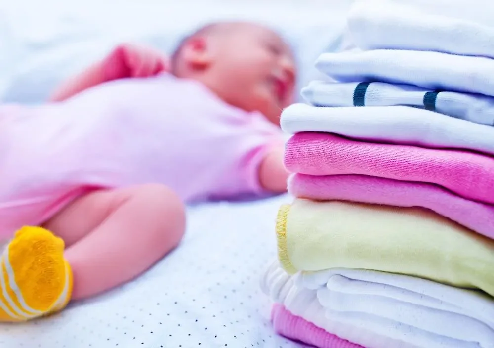 best organic baby clothes next to sleeping infant