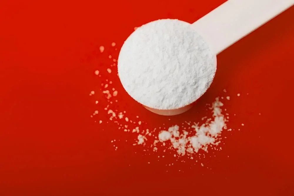 bcaa powder supplement on red background